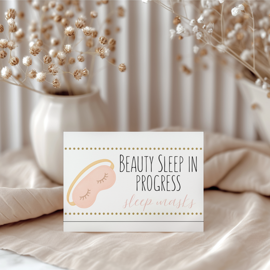 Card with 'Beauty Sleep in Progress' text and sleep mask illustration on a soft background with flowers.