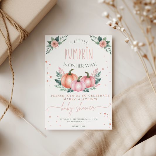 Baby shower invitation with pumpkins and floral elements on a neutral background