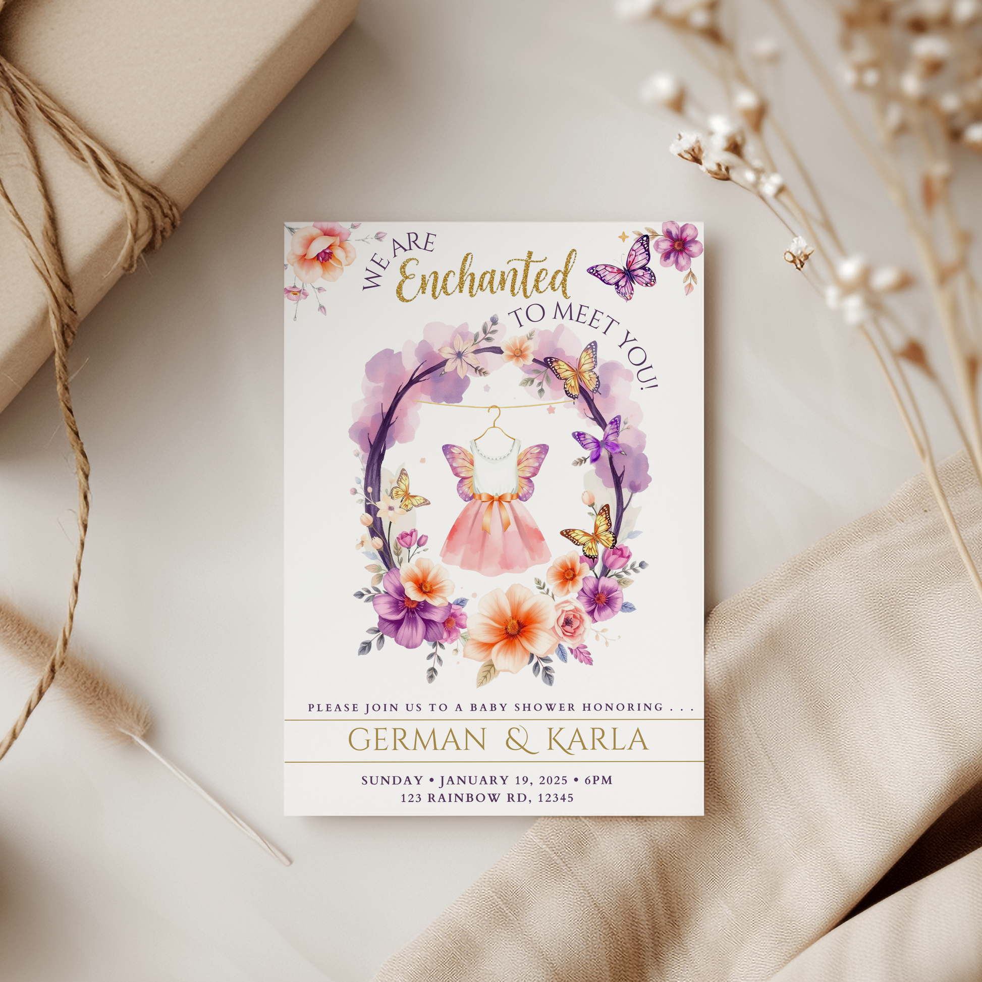 Baby shower invitation with floral and butterfly design on a neutral background