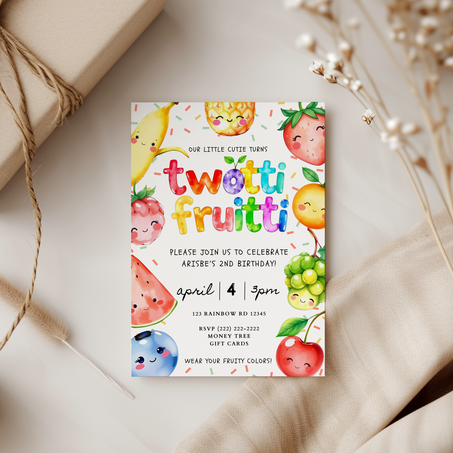 Fruit-themed birthday invitation card on a neutral background