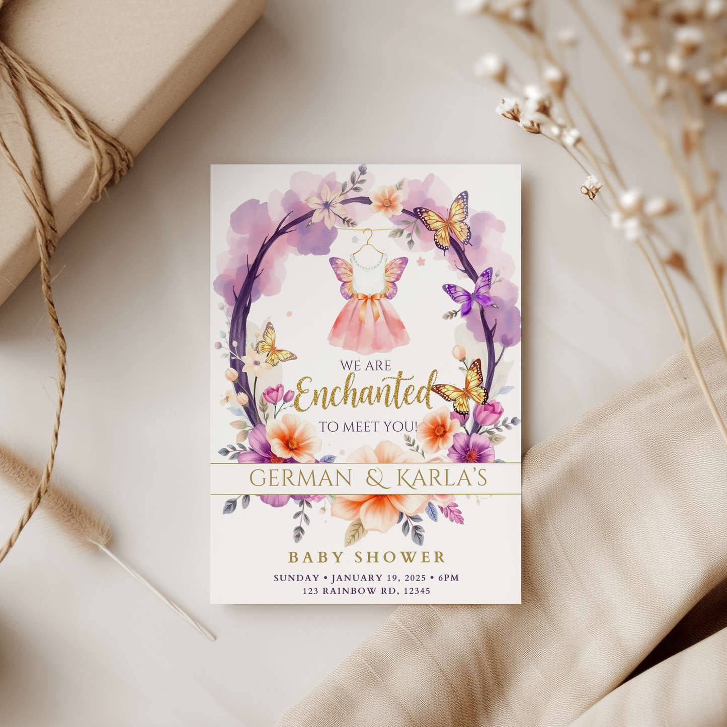 Baby shower invitation with floral and butterfly design on a neutral background