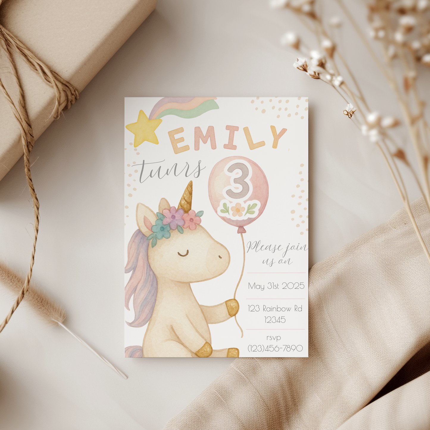 Invitation card with a unicorn design on a neutral background