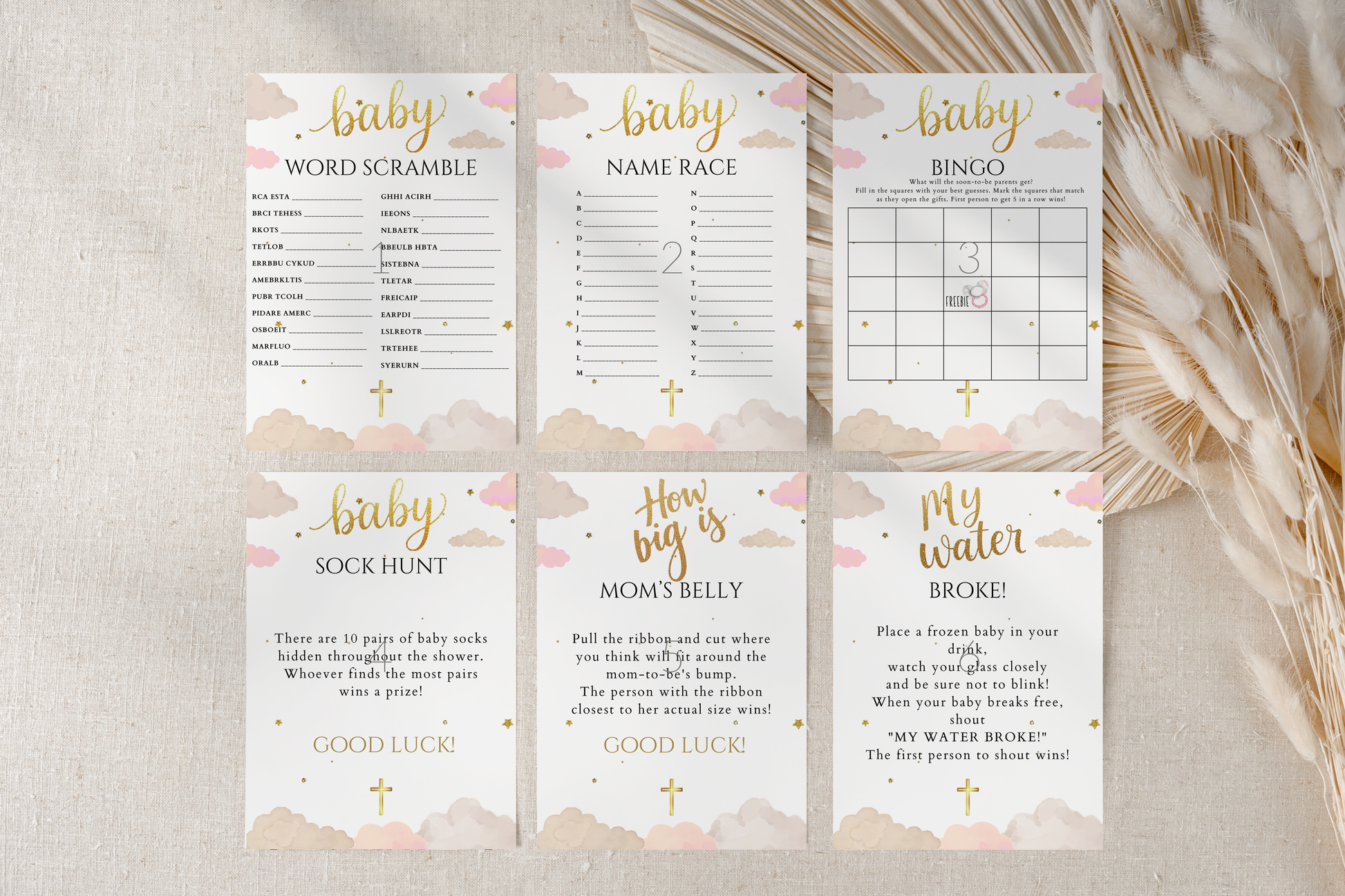 Set of baby shower games on a textured surface with decorative elements.