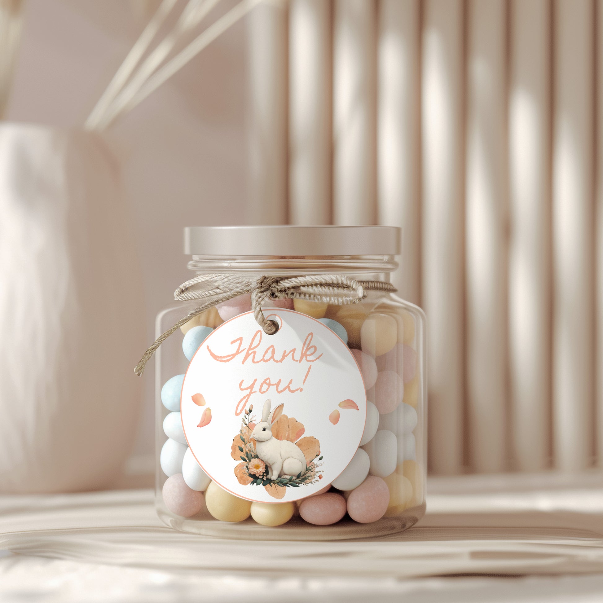 Jar of colorful candies with a 'Thank you!' tag on a neutral background