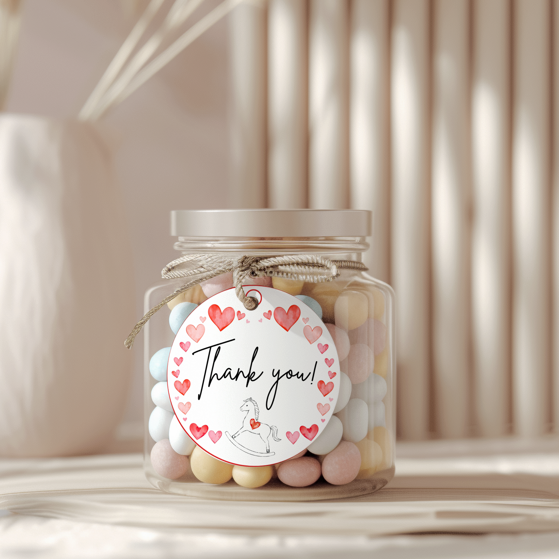 Jar of colorful candies with a 'Thank you!' label on a neutral background