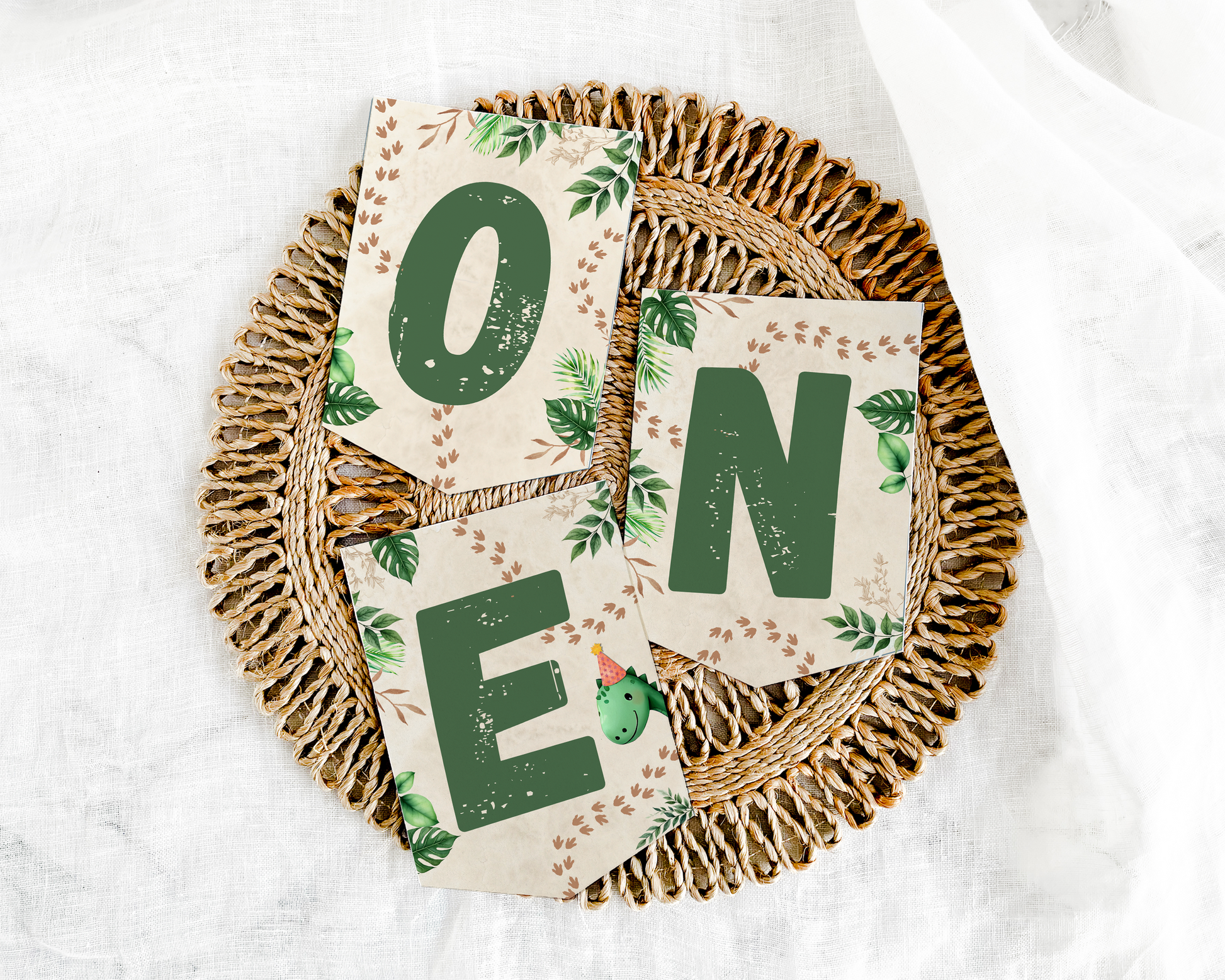 Decorative sign with 'ONE' on a woven plate against a white background
