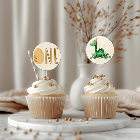 Two cupcakes with decorative toppers on a marble surface.