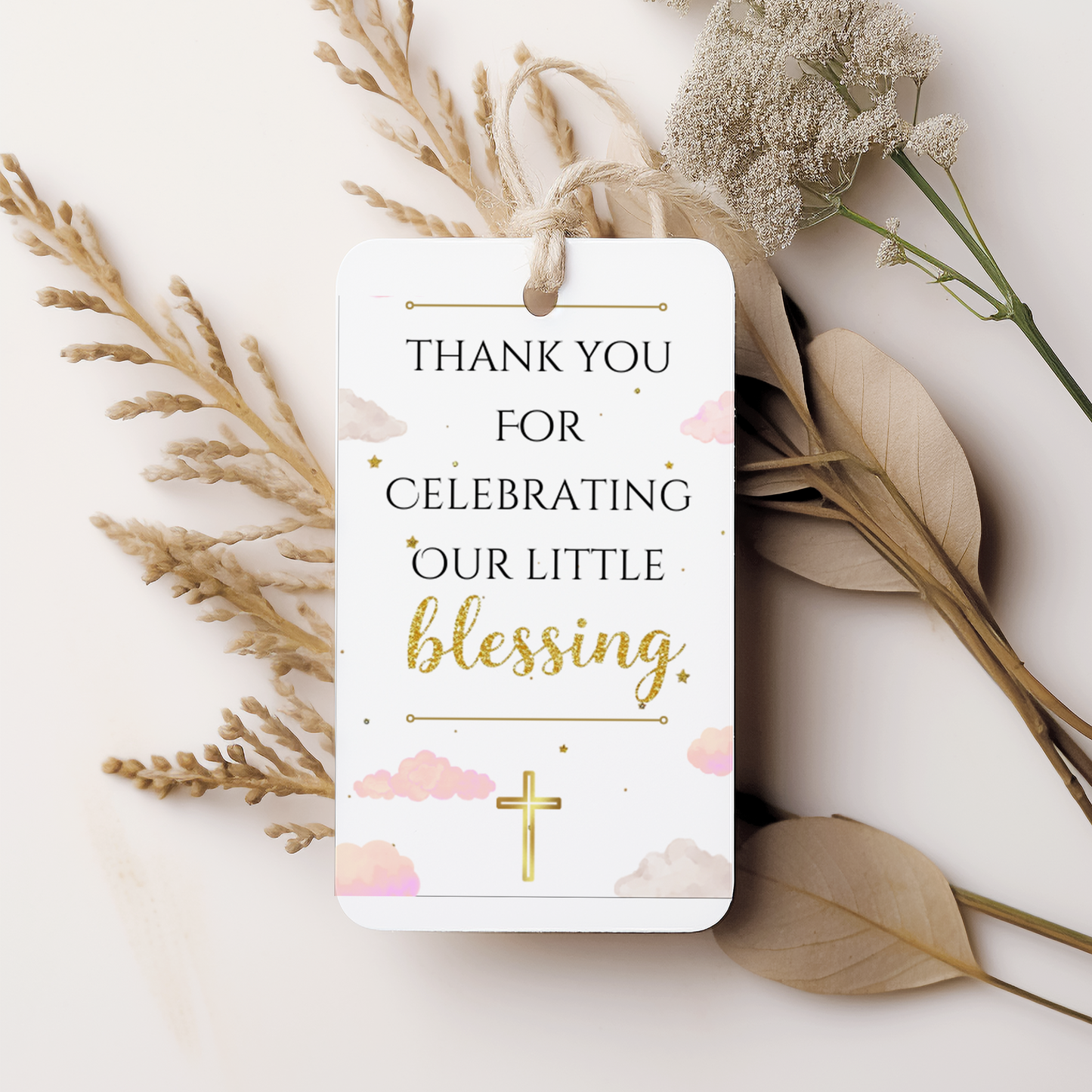 Gift tag with 'Thank you for celebrating our little blessing' text on a white background with dried flowers.