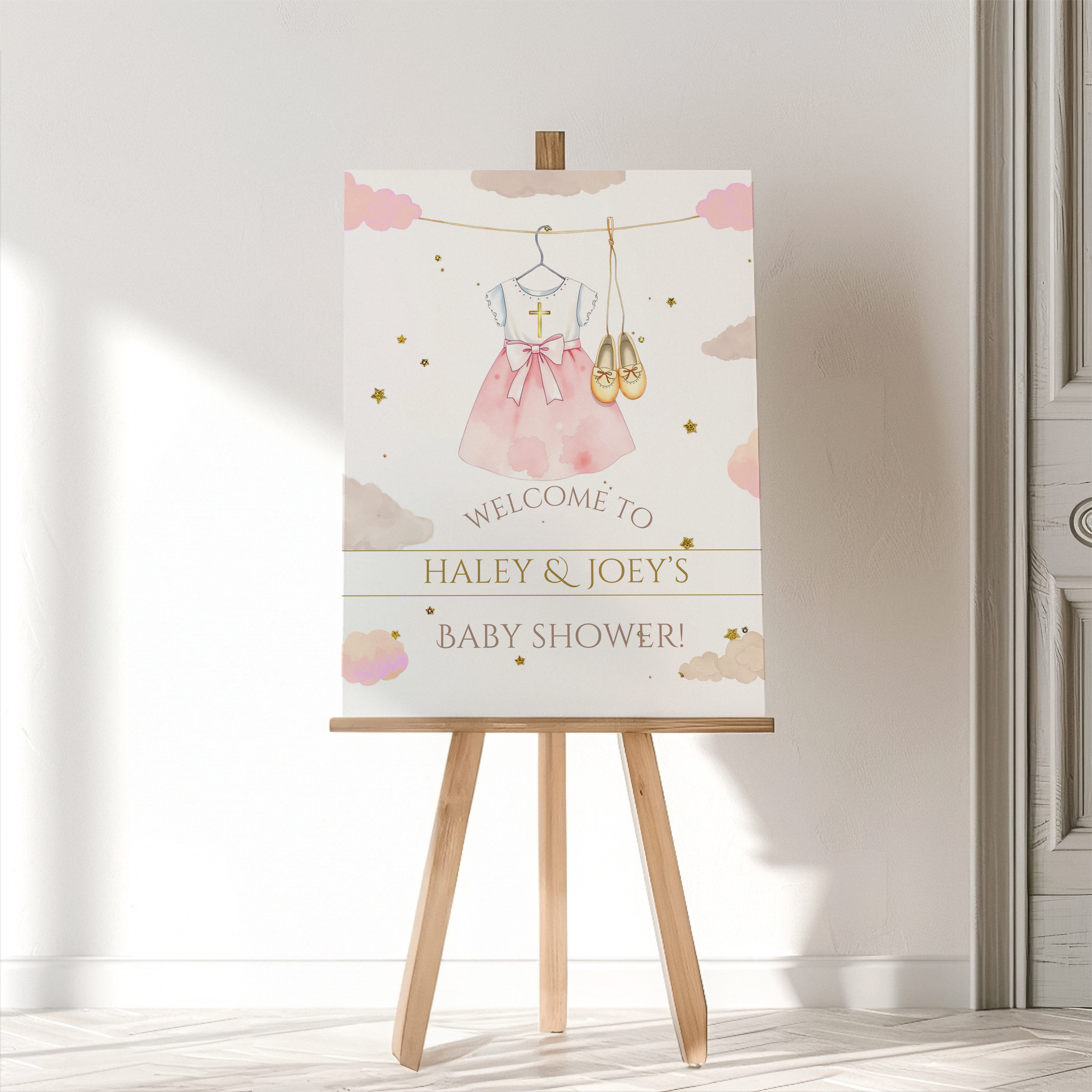 Baby shower welcome sign on a wooden easel with a white background