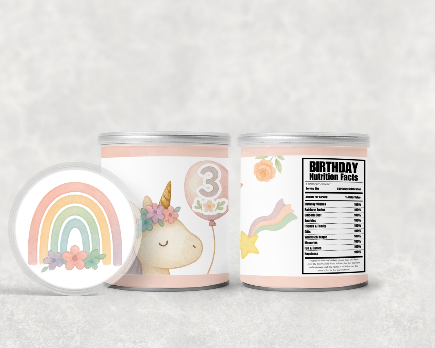 Two containers with unicorn-themed labels and a rainbow on a light gray background