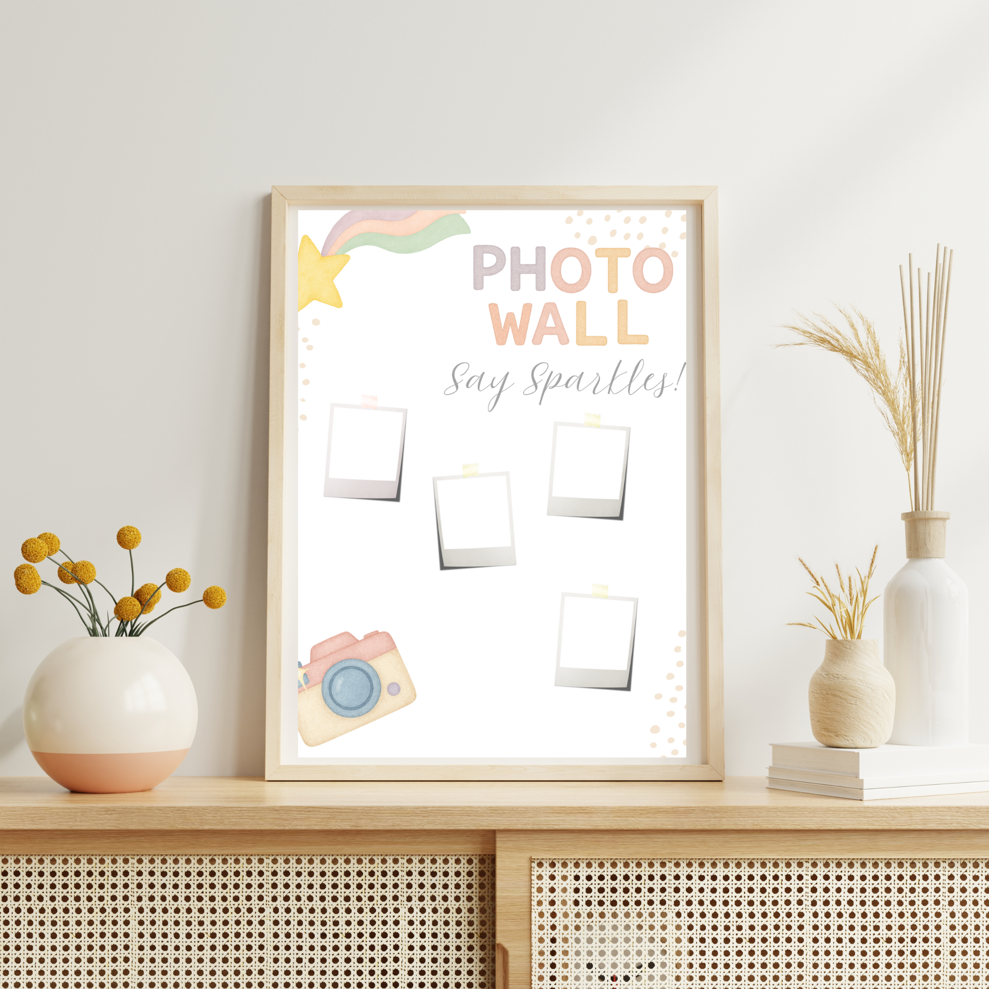 Decorative photo frame with 'Photo Wall Say Sparkles' text on a shelf with decorative items.
