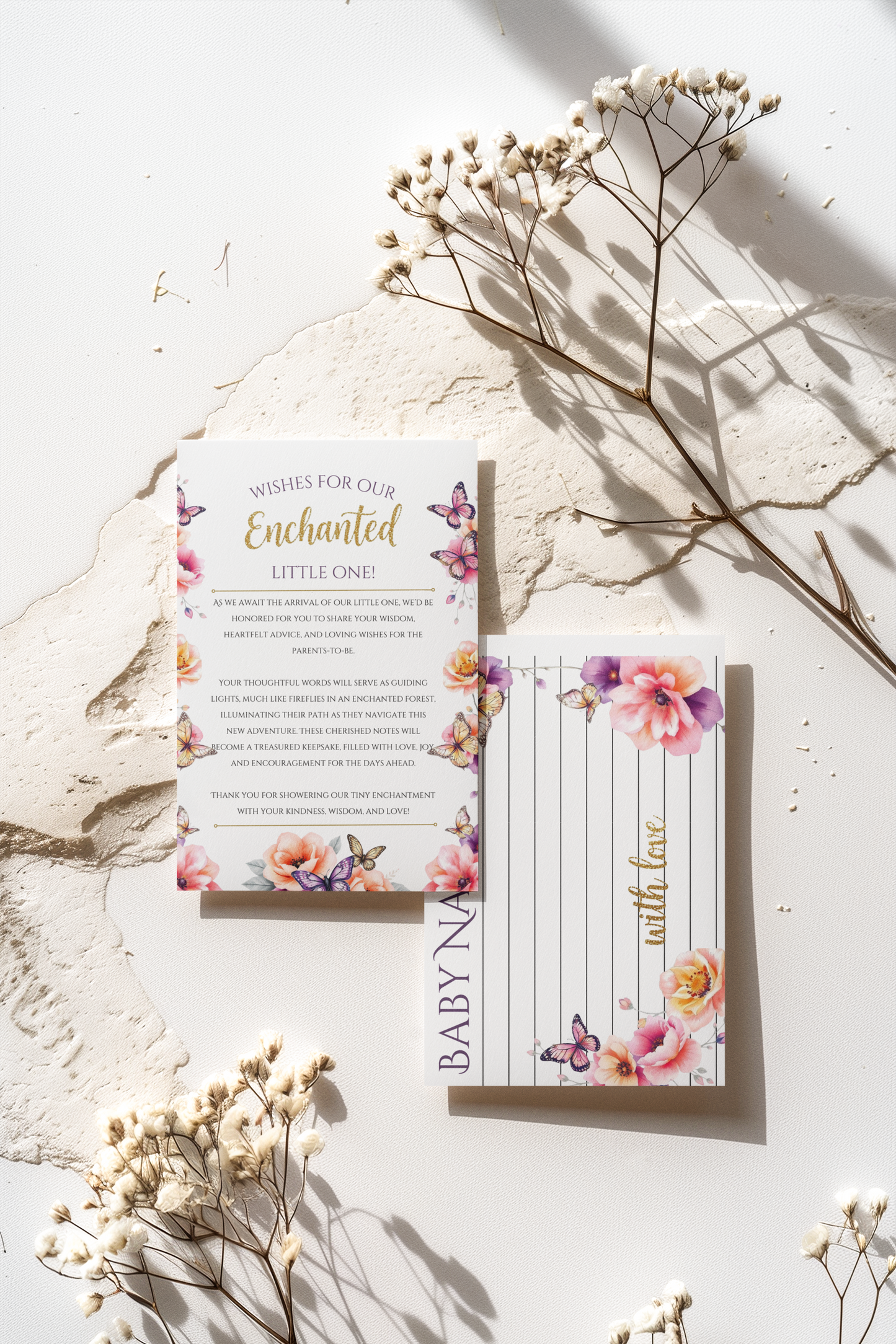 Baby shower wishes cards with floral design on a light surface with dried flowers.