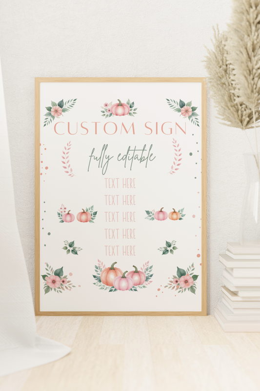 Decorative sign with floral and pumpkin designs on a white surface.