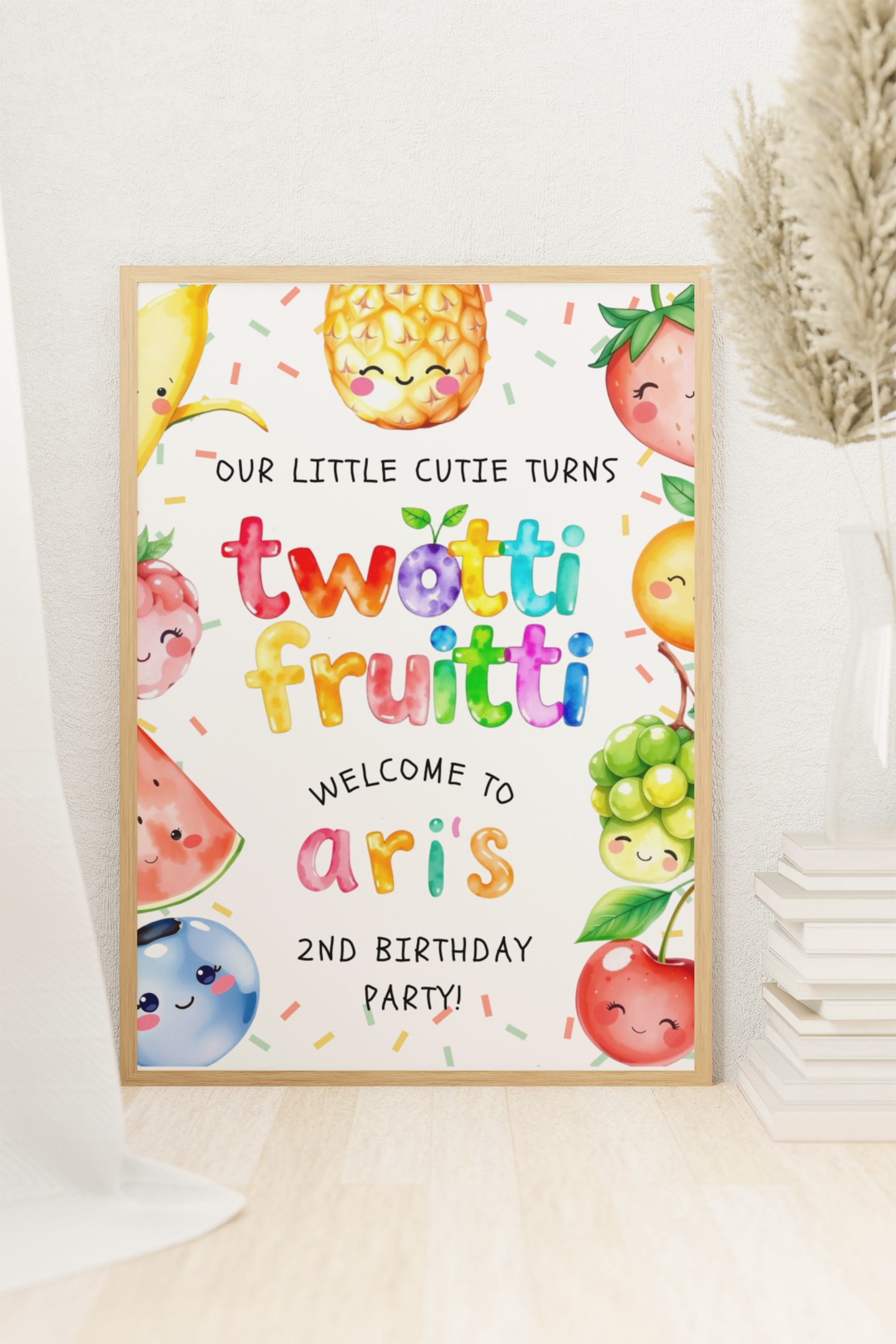 Framed birthday party invitation with colorful fruit illustrations and text.