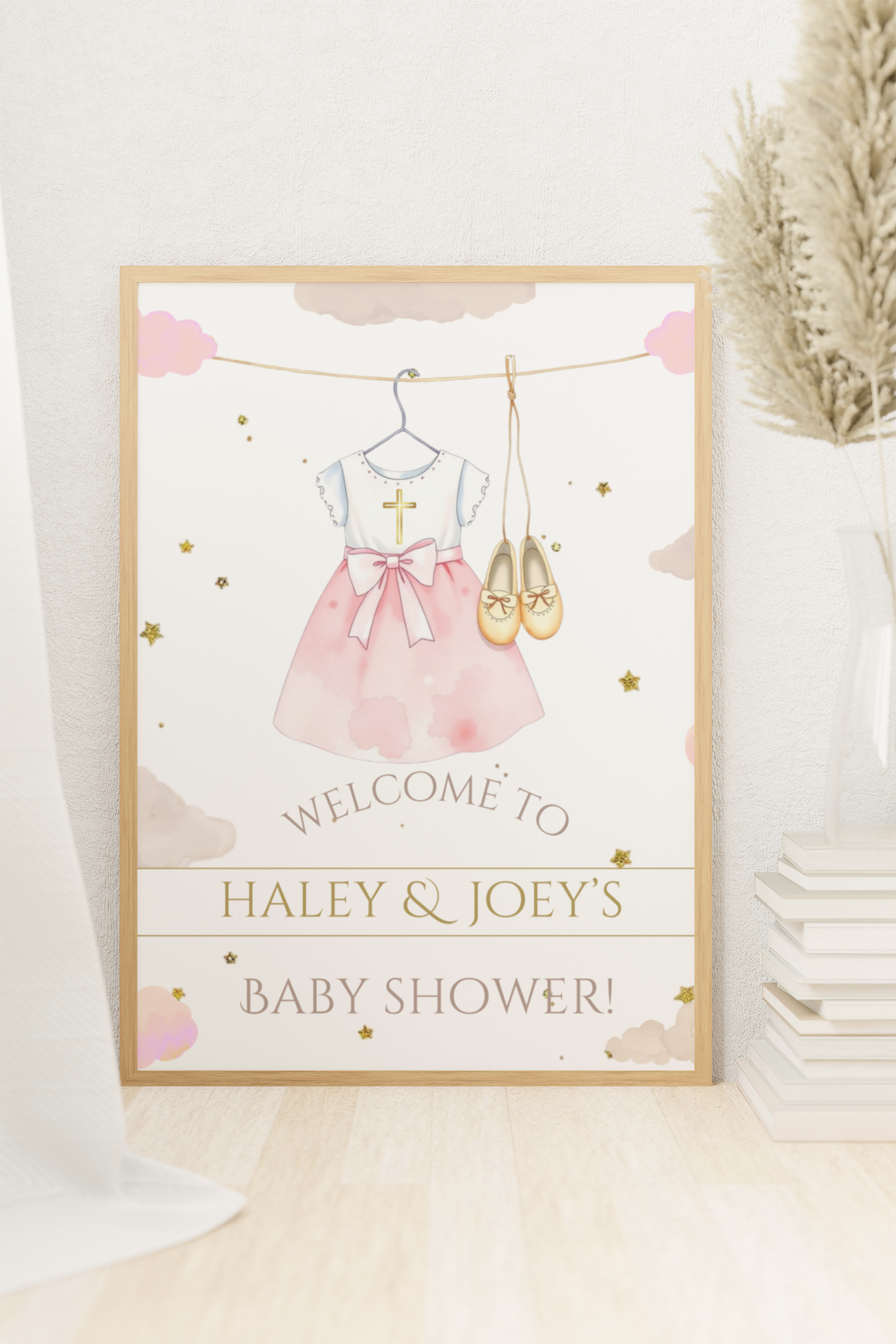 Baby shower invitation with dress, shoes, and ballet slippers illustration on a light background.