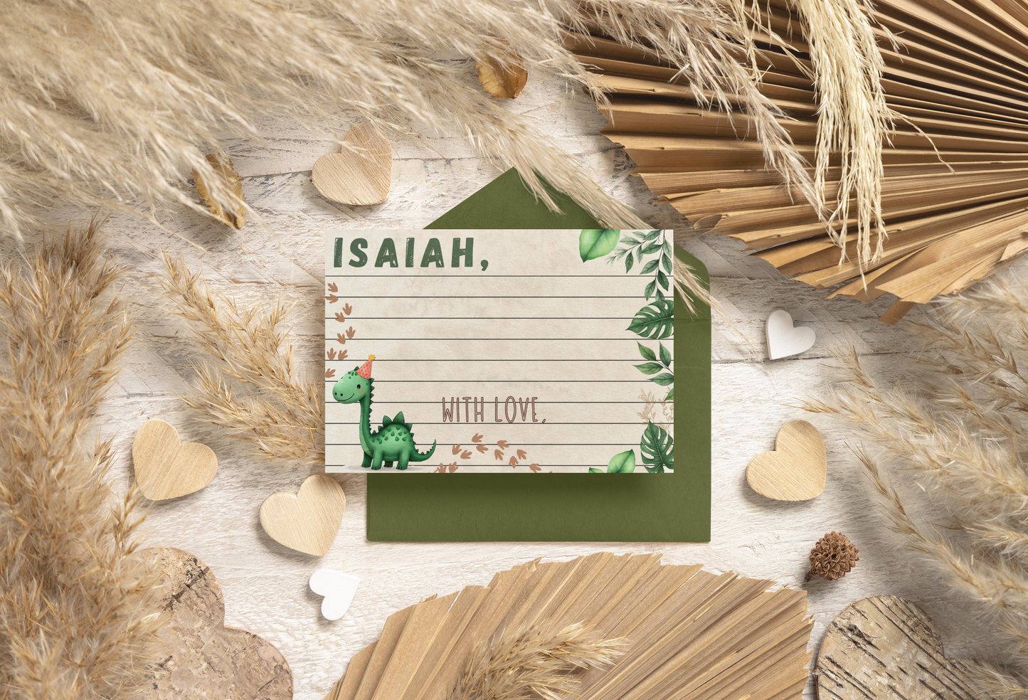 Note with 'ISAIAH' on a card surface with dinosaur decorative elements