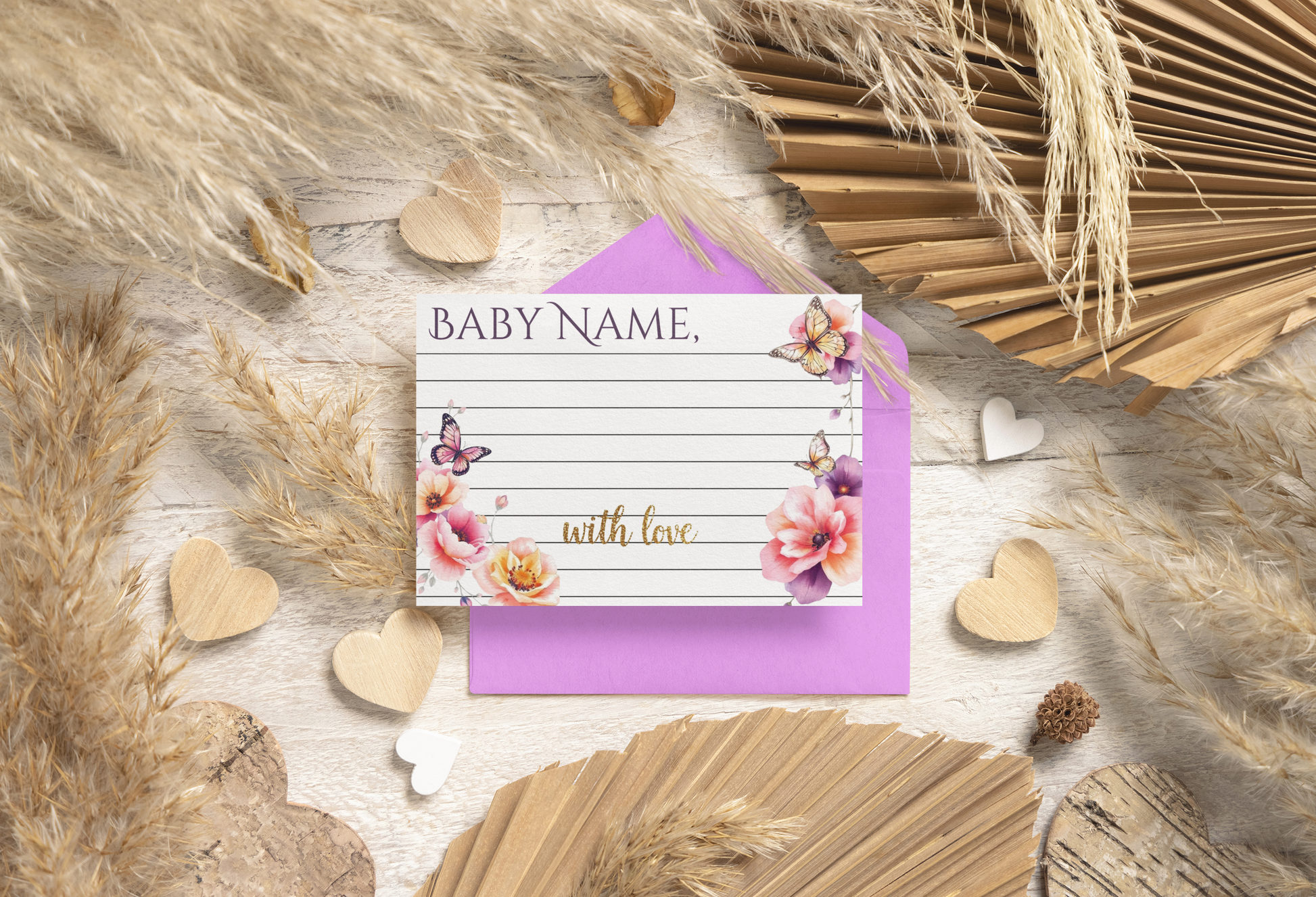 Baby announcement card with floral design on a textured surface with decorative elements