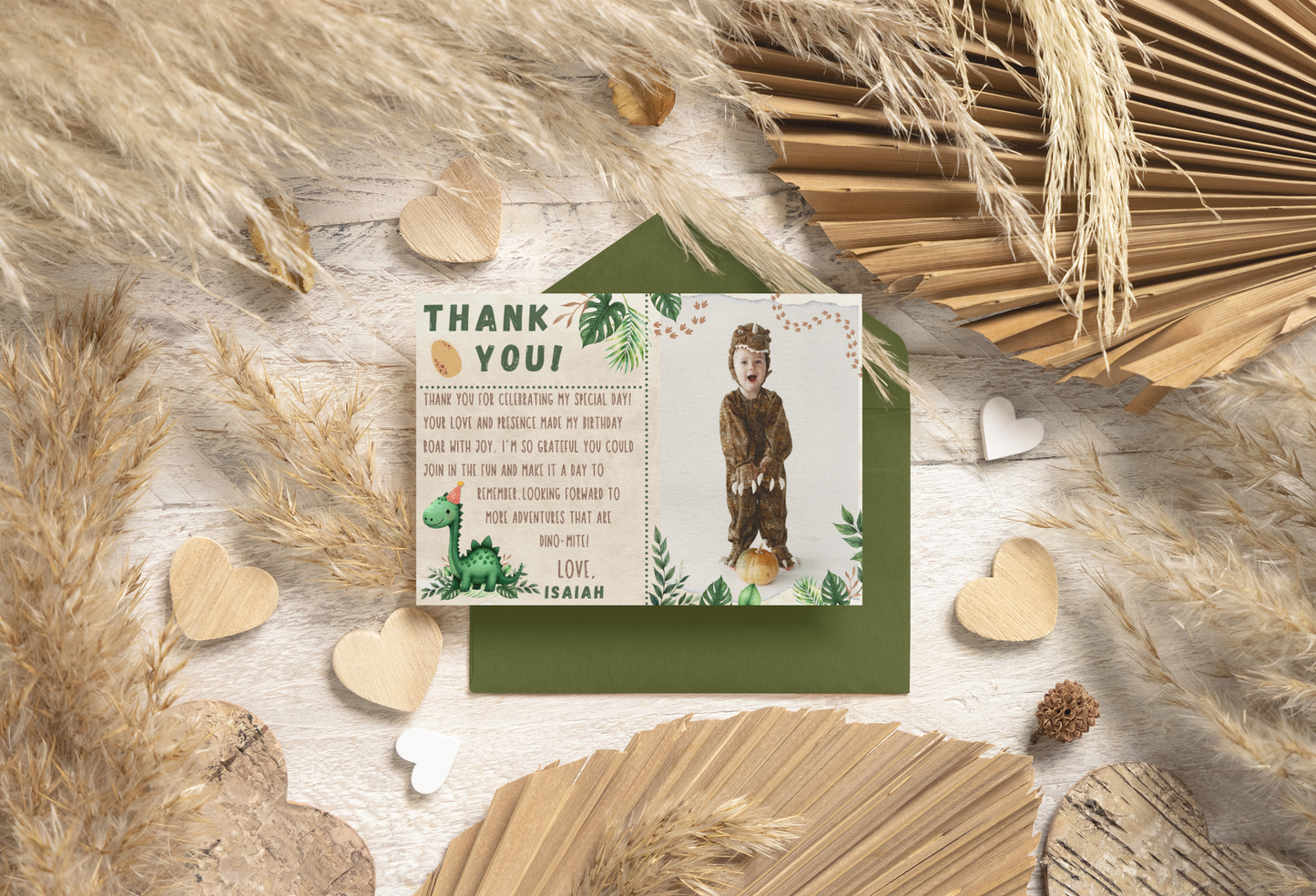 Thank you card with a child's photo and text, surrounded by decorative elements on a wooden surface.