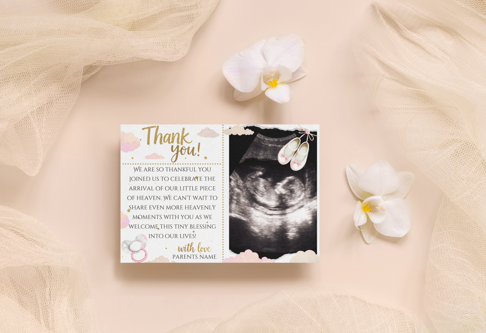 Thank you card with ultrasound photo and flowers on a soft fabric background