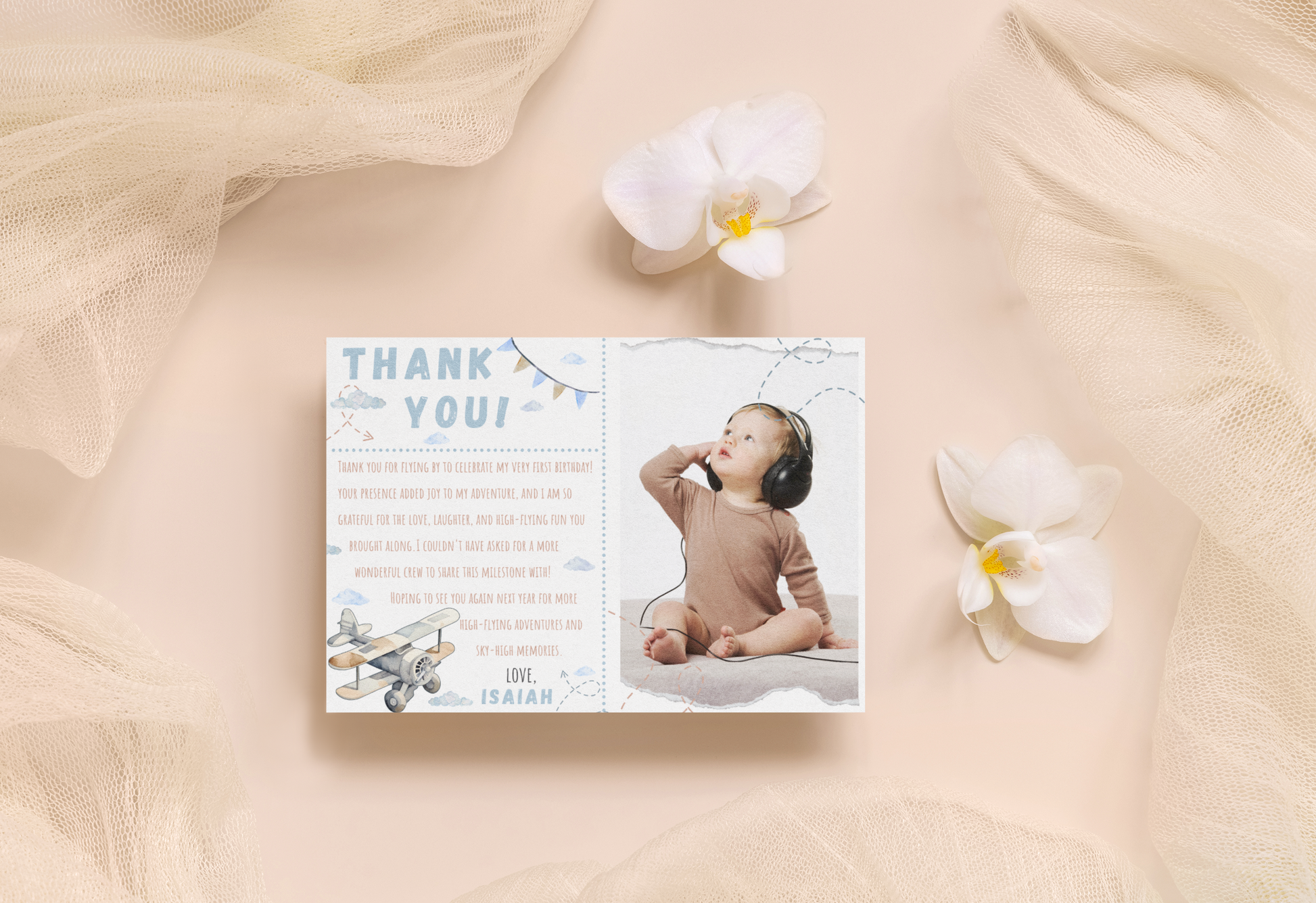Baby shower thank you card with a photo of a baby and flowers on a soft fabric background