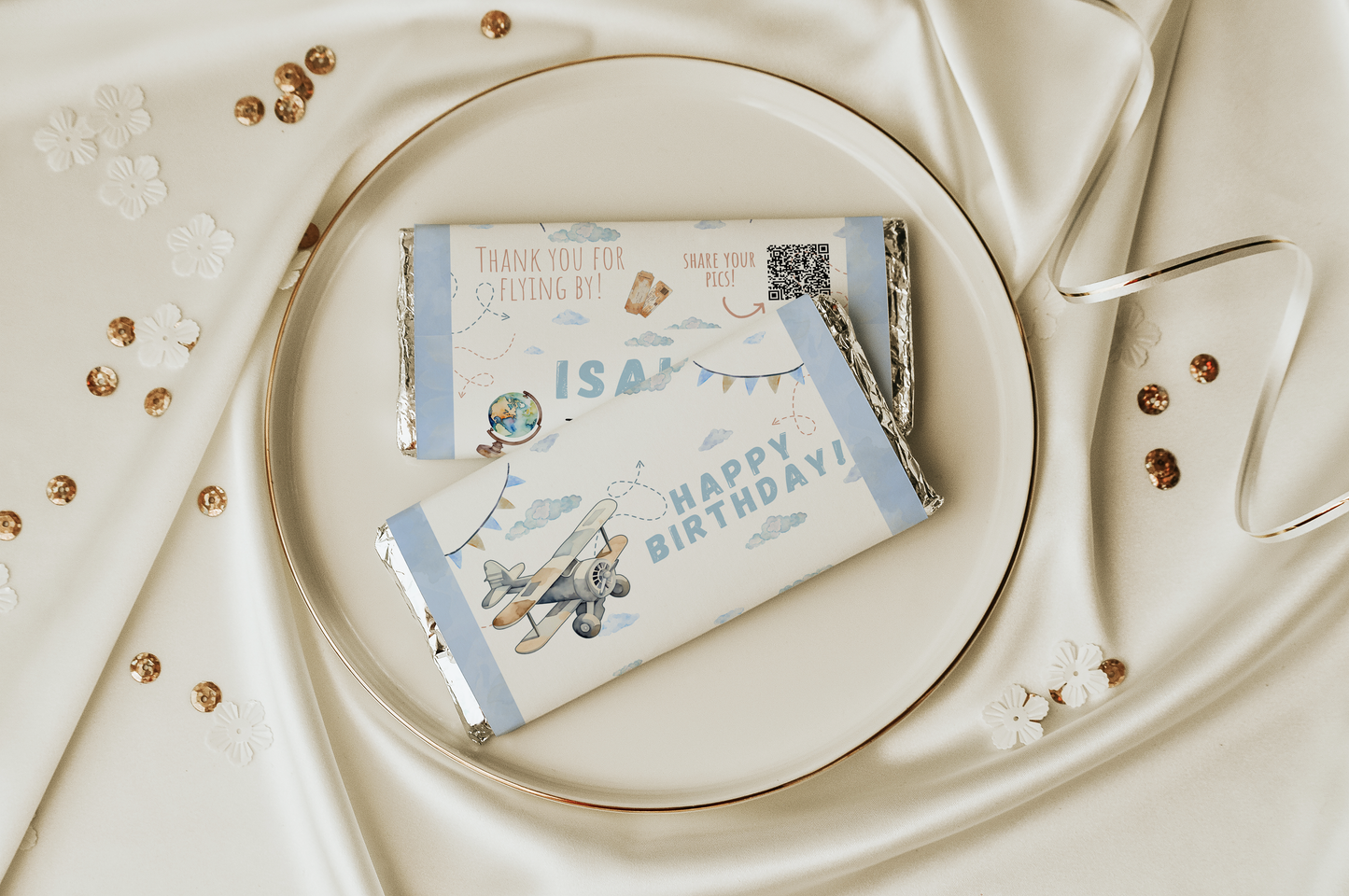 Gift card with airplane design on a decorative plate with gold accents