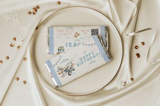 Gift card with airplane design on a decorative plate with gold accents